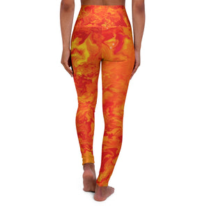 a woman wearing a red and yellow tie dye yoga pants.