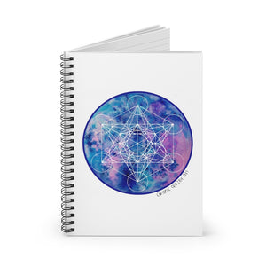 a spiral notebook with a sacred geometric design in the center.	