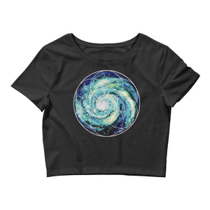 a black crop top with a spiral galaxy seed of life image on it.	