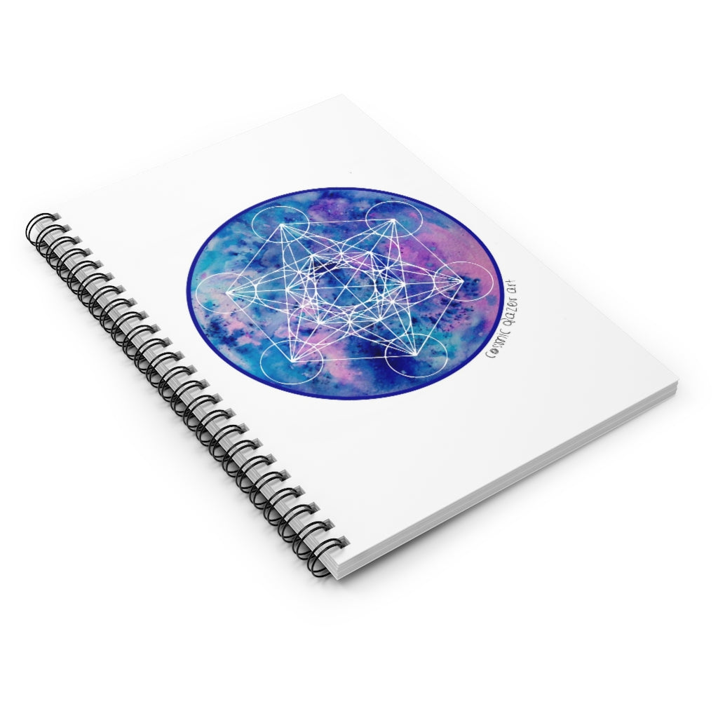 a spiral notebook with a sacred geometric design in the center.	