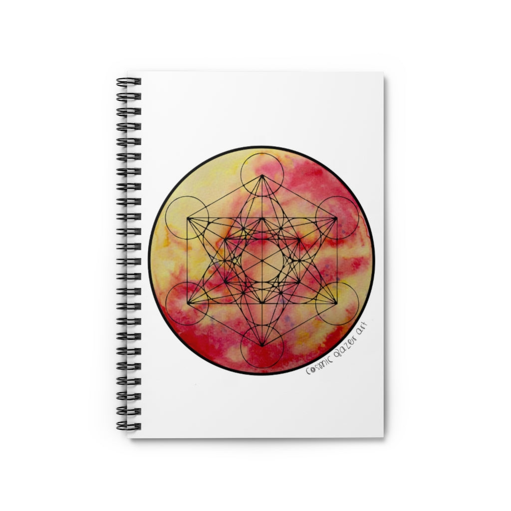 a spiral notebook with a solar painting and geometric design in the center.	