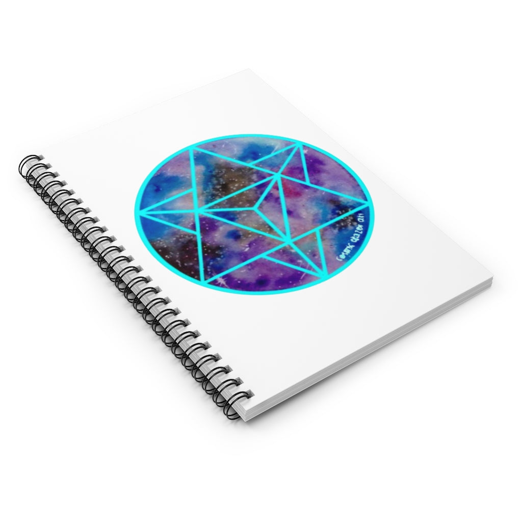 a spiral notebook with a geometric design in the center.	