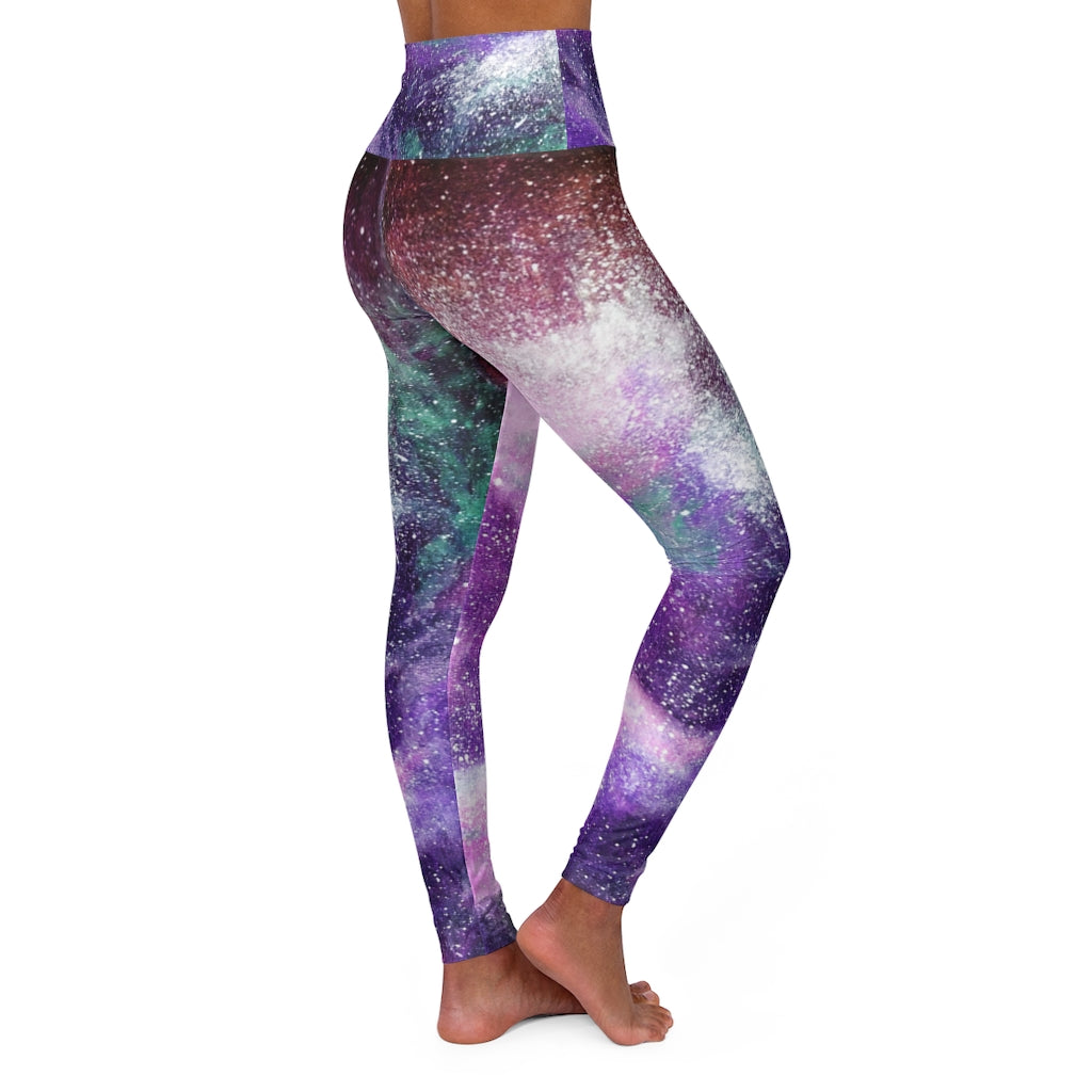 a women's yoga pants with a purple and green galaxy print.	