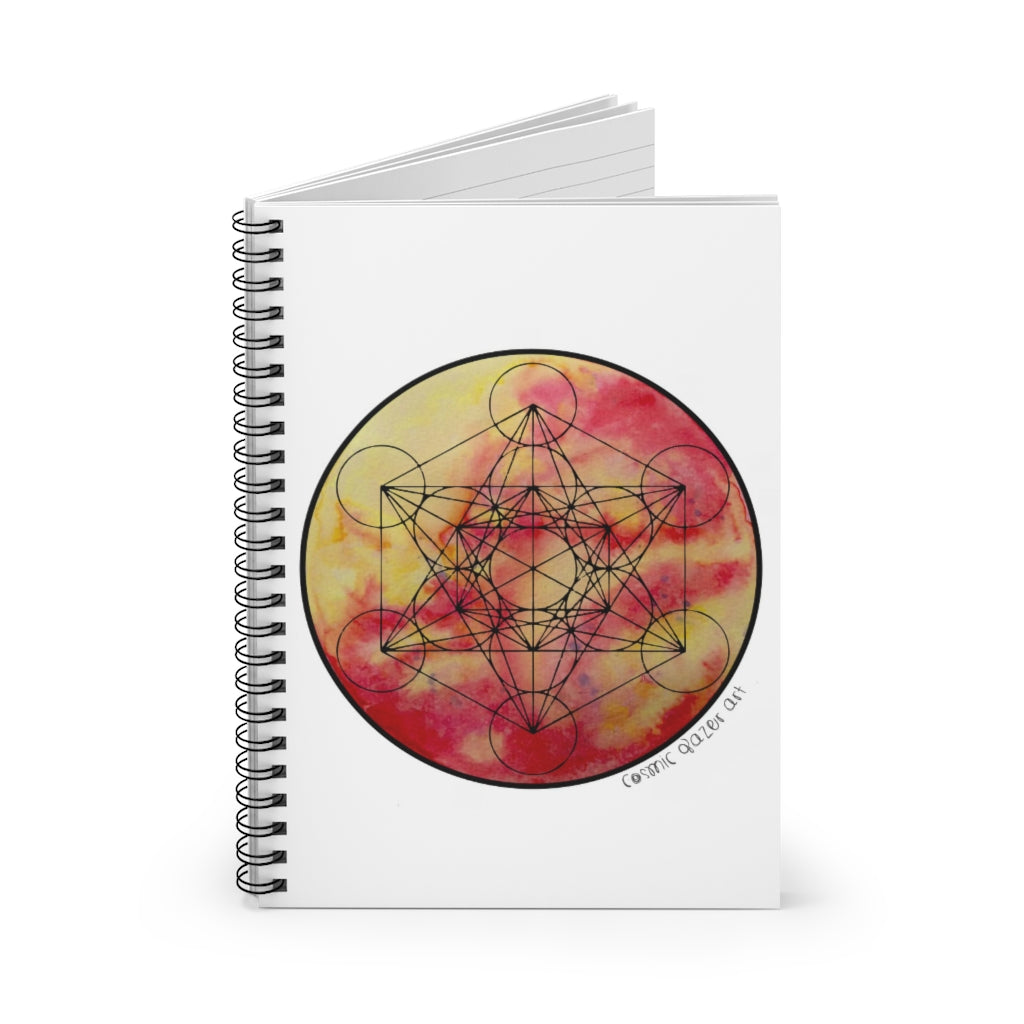 a spiral notebook with a solar painting and geometric design in the center.	