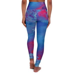a woman wearing a blue and pink psychedelic leggings.	