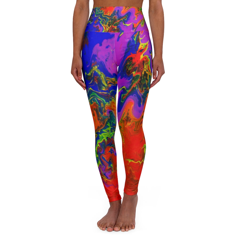 a woman wearing rainbow psychedelic leggings.	