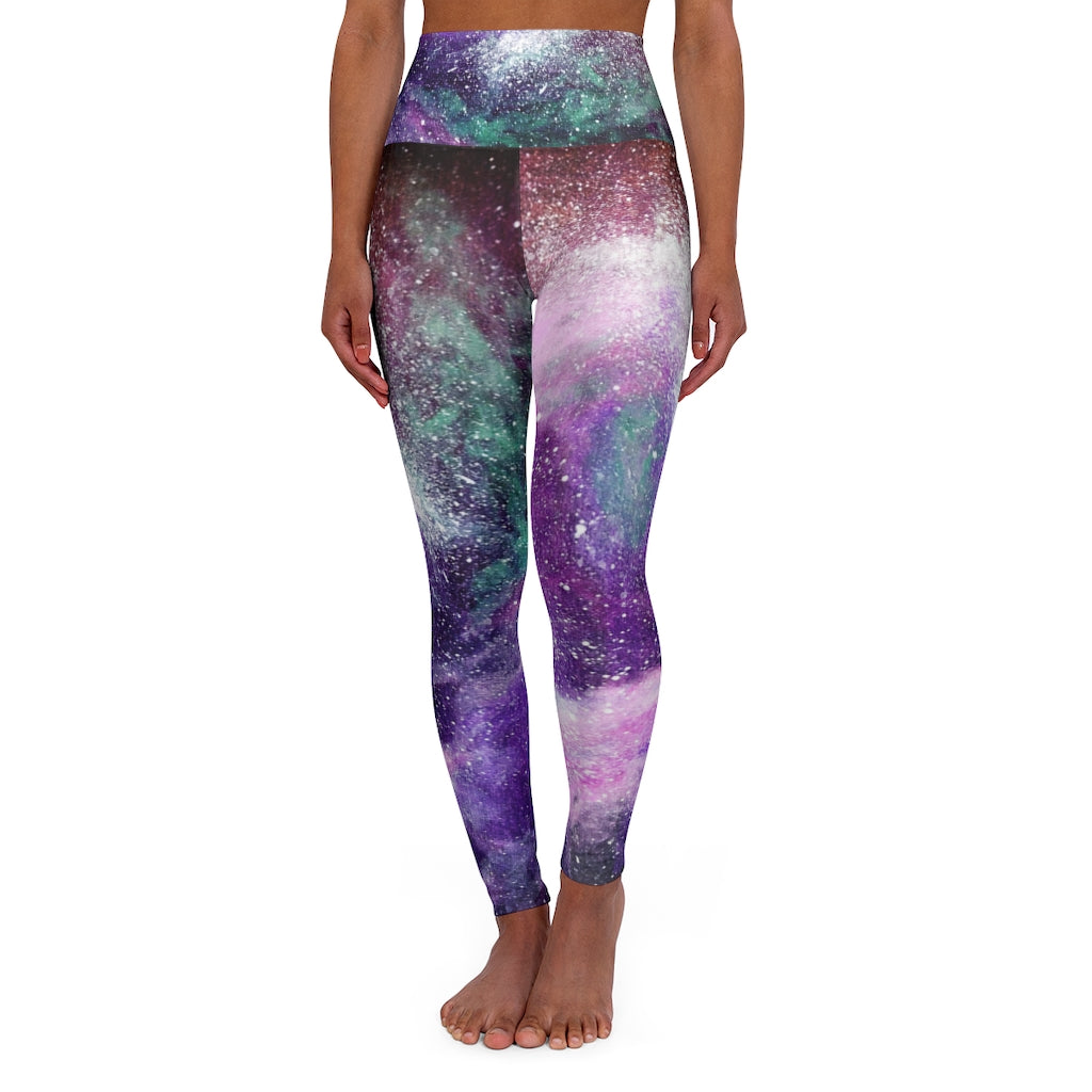 a women's leggings with a purple and green galaxy print.	
