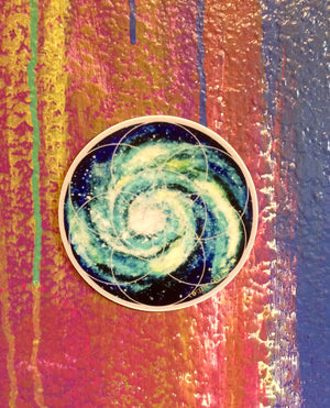an image of a spiral galaxy design on a sticker on a wall.	