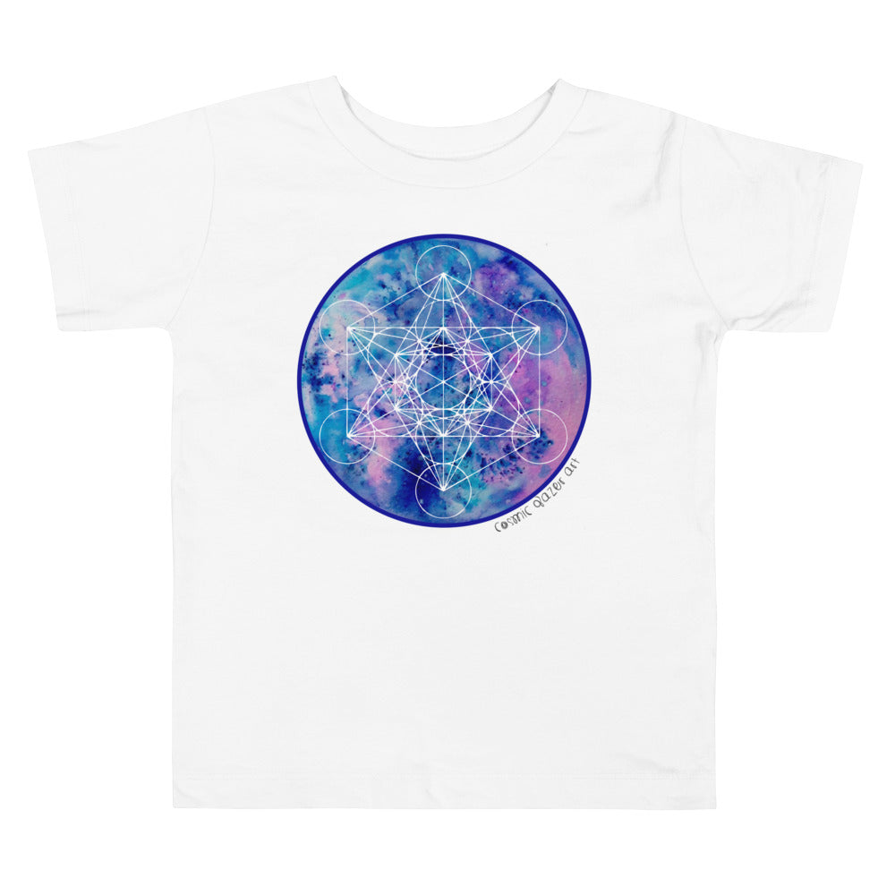 a white toddler t - shirt with a blue and purple geometric design.	