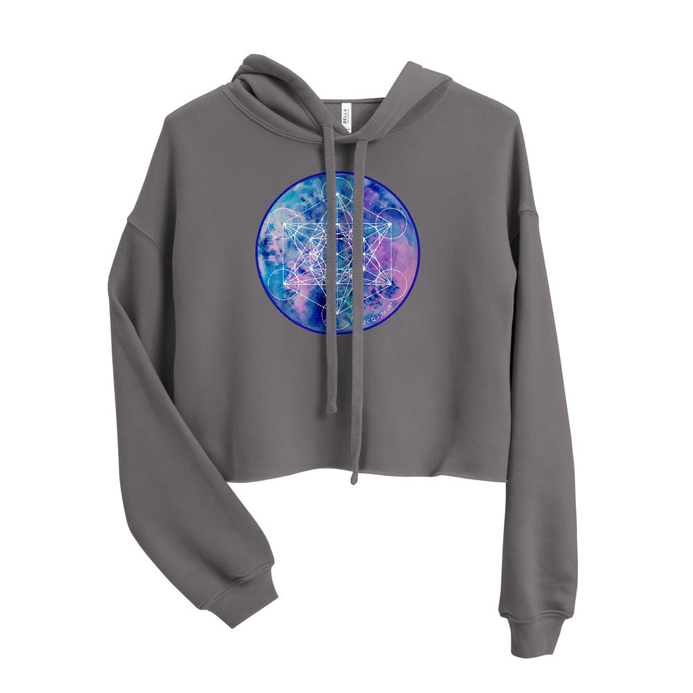 a dark grey crop top hoodie with a blue and purple galaxy sacred geometry print on it.