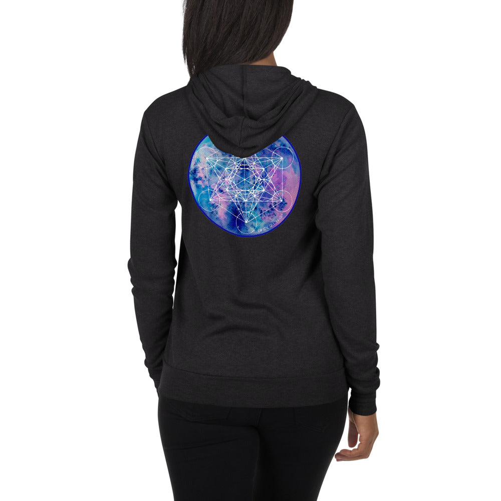 a woman in a charcoal zip hoodie with a blue and purple geometric design.	