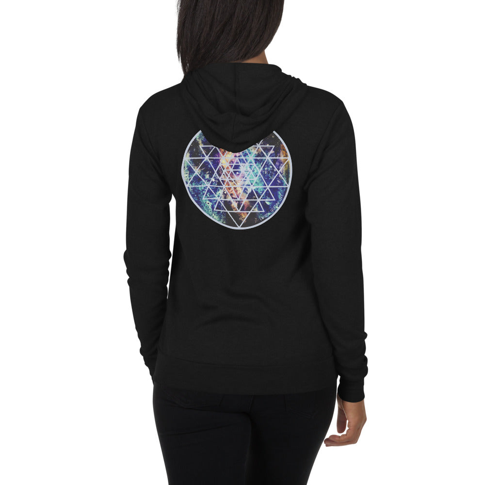 a woman in a black zip hoodie with teal, gold and purple galaxy and a geometric design.	